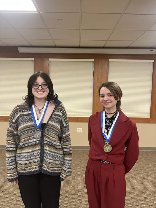 Brittany and Ella with their medals after the Verona oratorical contest